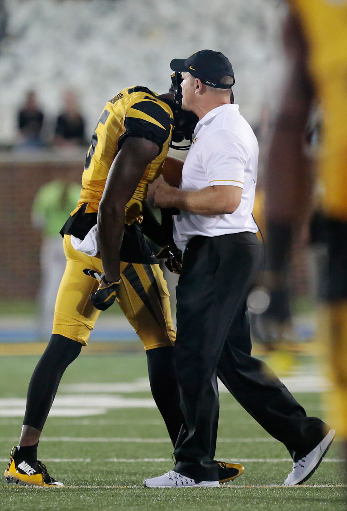 Barry Odom whispers to J'Mon Moore